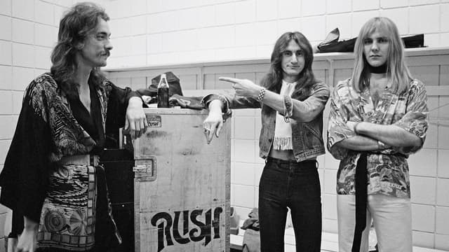 “He was like an alien. He could talk about anything. That’s when we said, ‘Let’s make him do lyrics!’”: Rush’s Neil Peart, an exploding golf ball and two career-changing conversations
