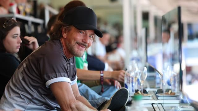 Watch Pearl Jam vocalist Eddie Vedder shower himself with Belgian beer as the USA crash out of the FIFA World Cup in Seattle, despite Donald Trump's unprecedented interference