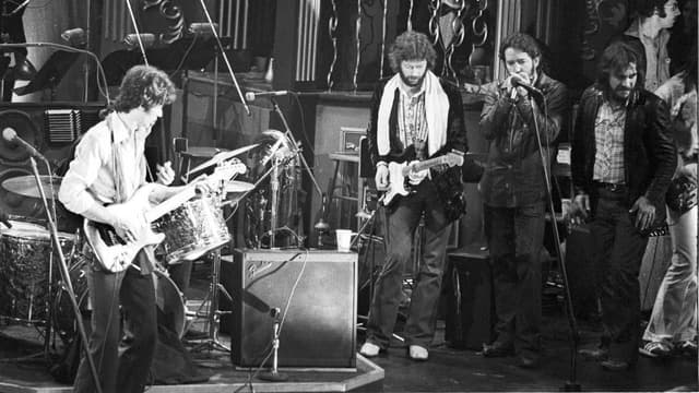 "The whole song turned into kind of a guitar dialogue." Watch the historic footage of Robbie Robertson saving Eric Clapton before they go head-to-head in a duel for the ages